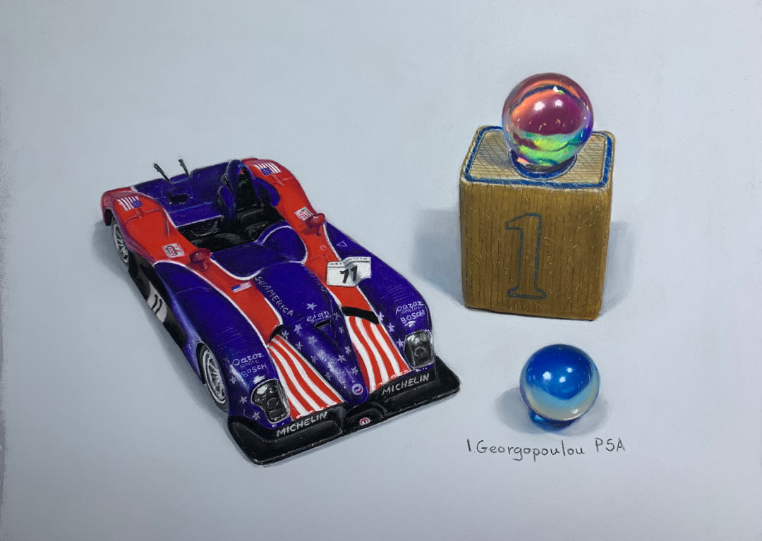 Irene Georgopoulou, a talented artist known for her medium of drawings, showcases her skills with a detailed depiction of the "One Car" race car positioned beside a wooden box.