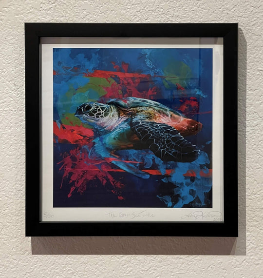 The Lindsey Kustusch | The Green Sea Turtle | Limited Edition Print by Lindsey Kustusch highlights a sea turtle swimming through vivid blue and red hues—an ideal framed art piece for sea turtle lovers and conservation supporters.
