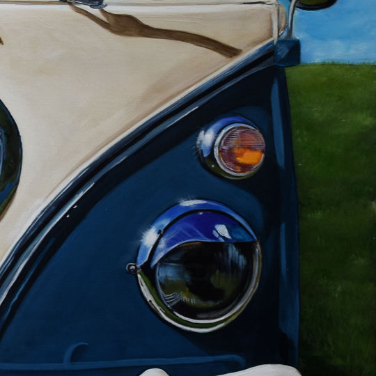Close-up of a 1967 Volkswagen Samba/Kombi Bus—28x28" art by Shan Fannin—showing headlight, indicator, cream & blue body, and grassy field. Ideal for VW Kombi fans or as a Shan Fannin limited edition wall print.
