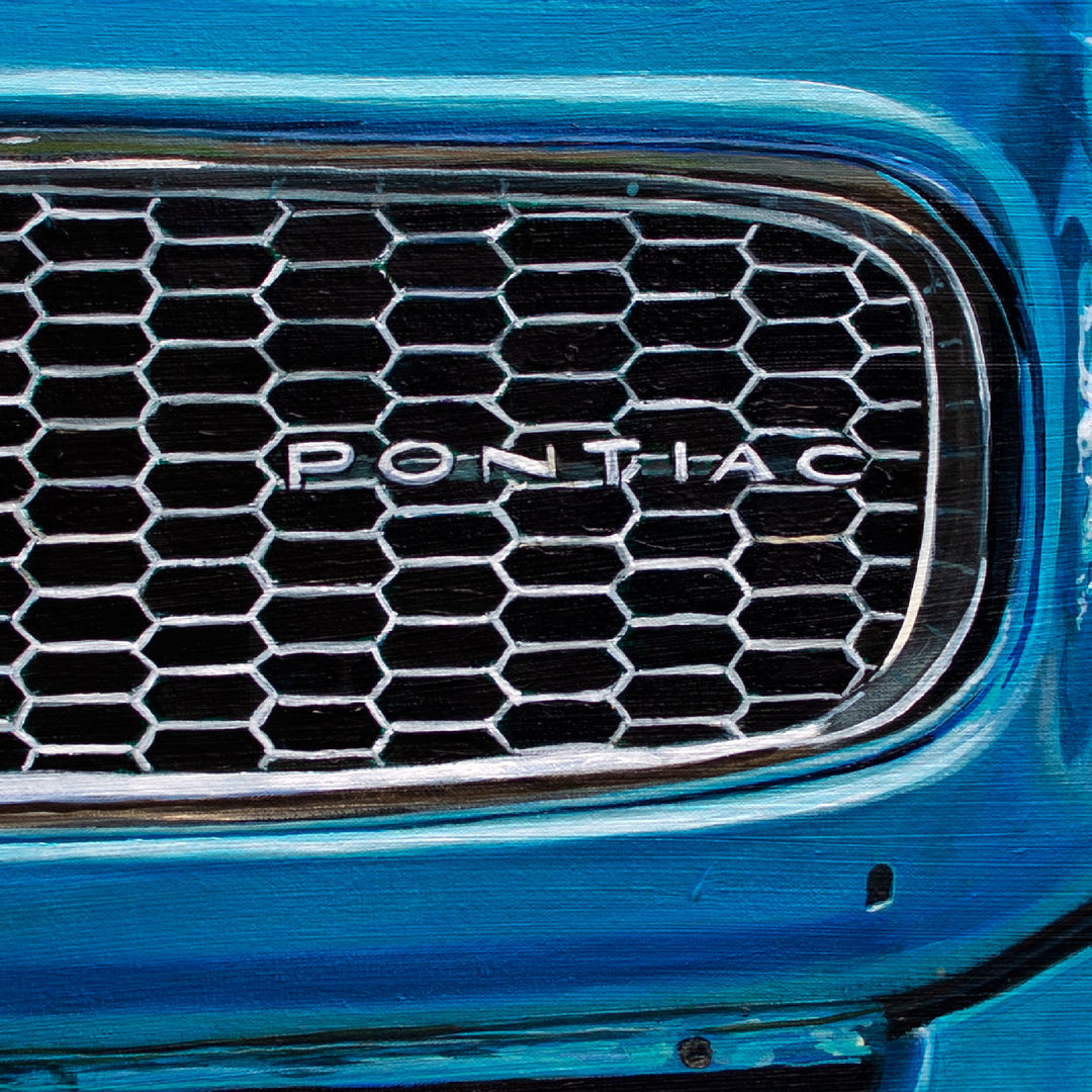 Close-up of a 1972 Pontiac Firebird Formula 400 M22 grille with honeycomb pattern and "PONTIAC" badge, blue bodywork. Limited edition 28 x 40" giclée print by Shan Fannin.
