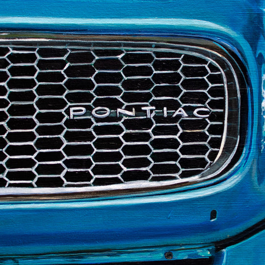 Close-up of a 1972 Pontiac Firebird Formula 400 M22 grille with honeycomb pattern and "PONTIAC" badge, blue bodywork. Limited edition 28 x 40" giclée print by Shan Fannin.