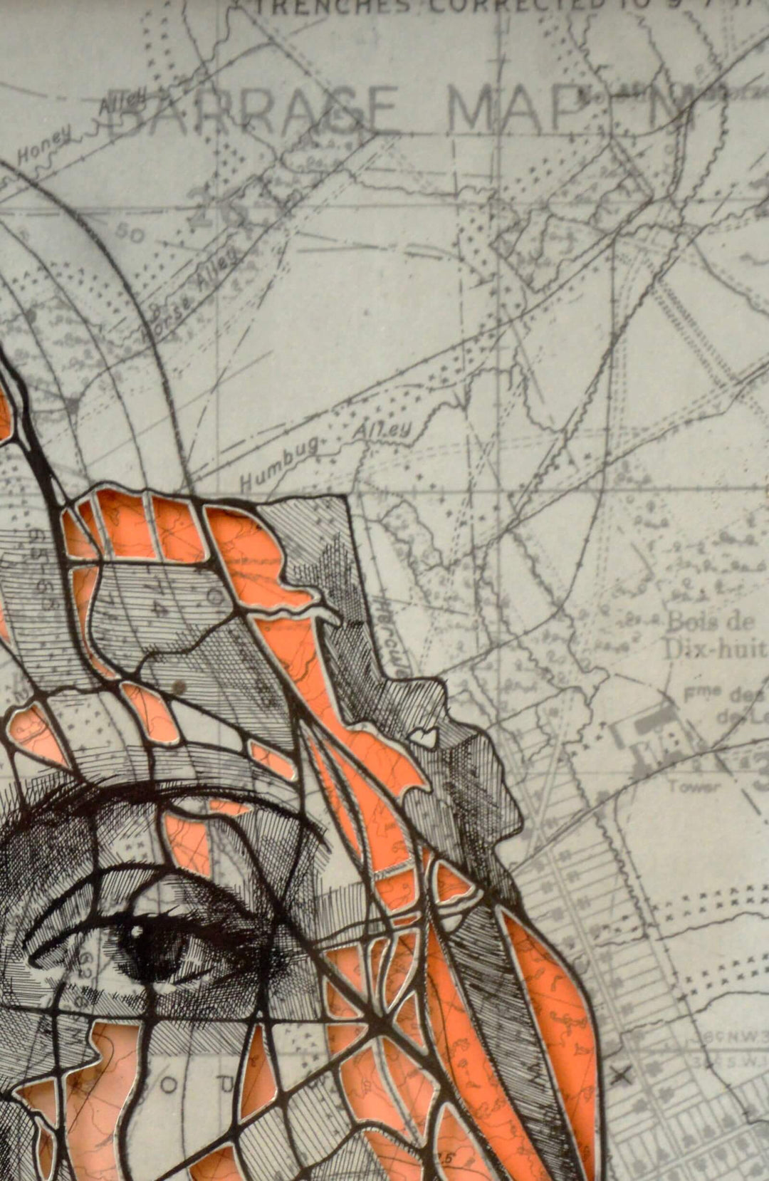 A drawing of a woman's face on a map using the Ed Fairburn "Western Front Cutout I".