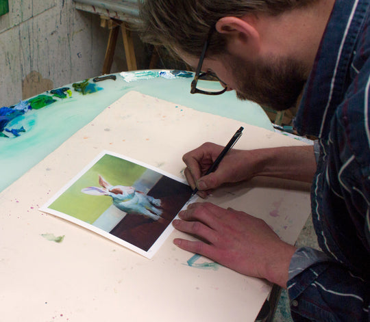 A man is painting a picture of a Benjamin Björklund | "Gwyneth" bunny.