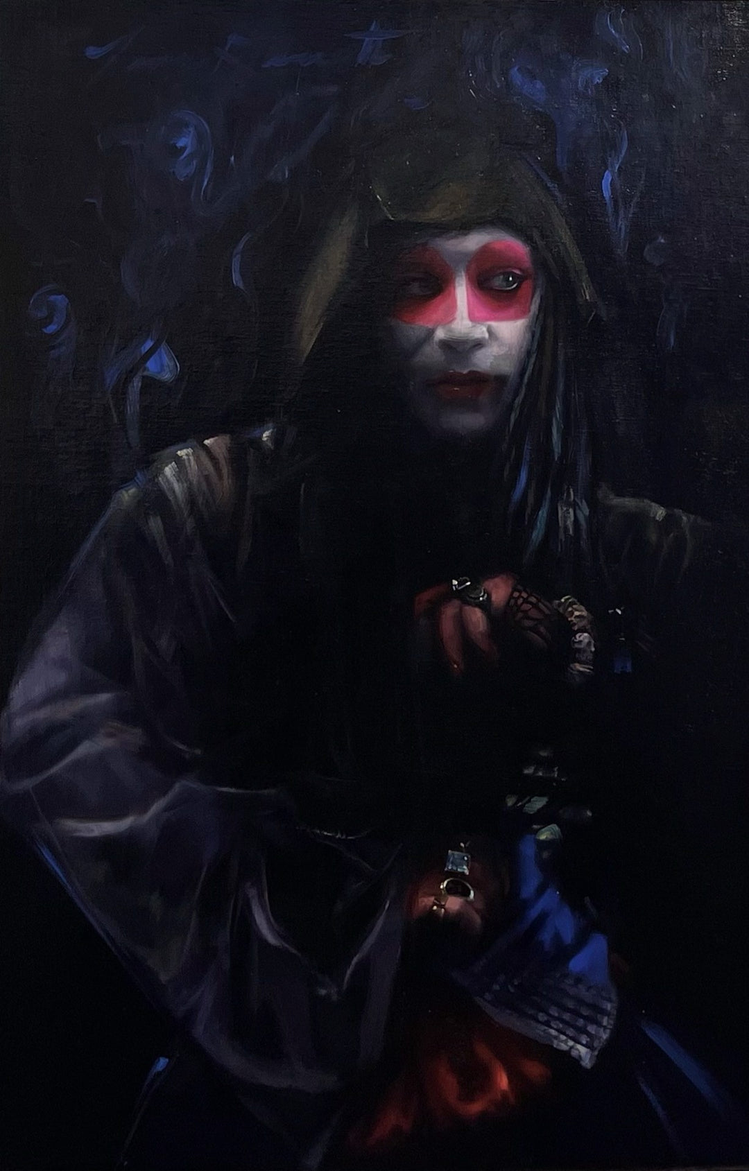 A Tina Garrett - "Magique Noir" painting, depicting a woman with red eyes and black hair, created using oil on board.