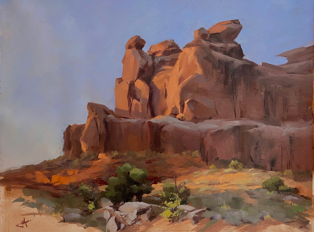 An oil painting capturing a mesmerizing sandstone sunrise of a rock formation in the desert, created by Judd Mercer - "Sandstone Sunrise, 2021" from the brand Judd Mercer.