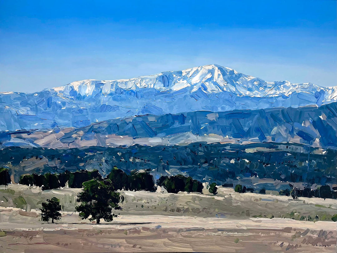 An oil painting of snow capped mountains in the Colorado Plains, measuring 36 x 48 inches, called "Colorado Plains" by David Shingler.