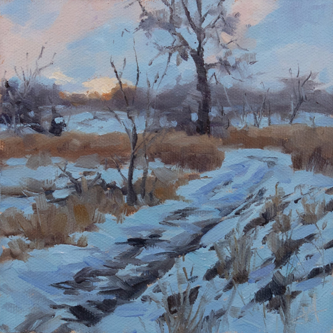 The mesmerizing oil painting, "Cold Track, 2022," by Judd Mercer beautifully captures the serene essence of a snow-covered field. The artist masterfully uses oils to convey the tranquil and cold atmosphere, transporting viewers into this surreal world.
